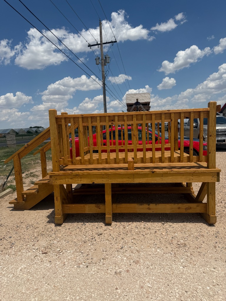 Custom deck with railings and stairs - front view